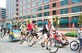[photo, Bicycle riders, including bicycle built for four, Market Place, Baltimore, Maryland]